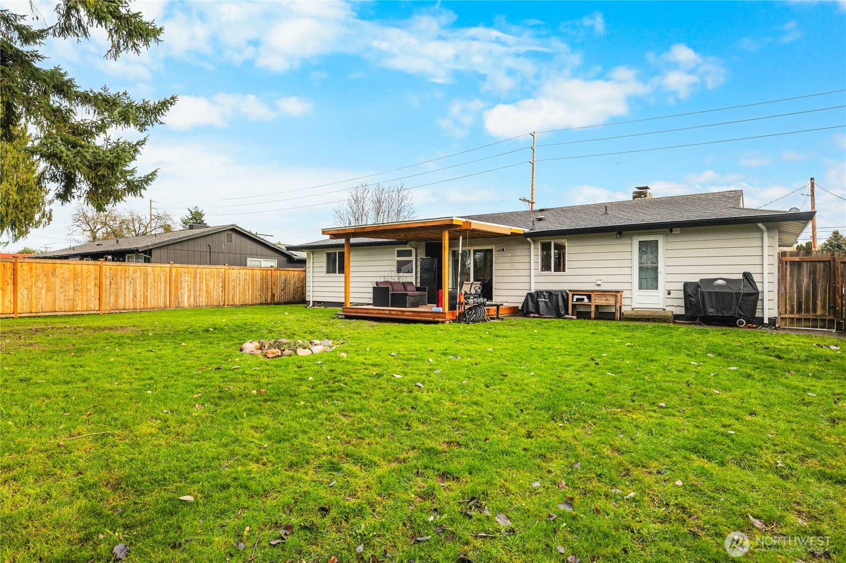 924 9th Street Southwest Puyallup, WA 98371 - Photo 30 of 38 a front view of a house with a yard table and chairs