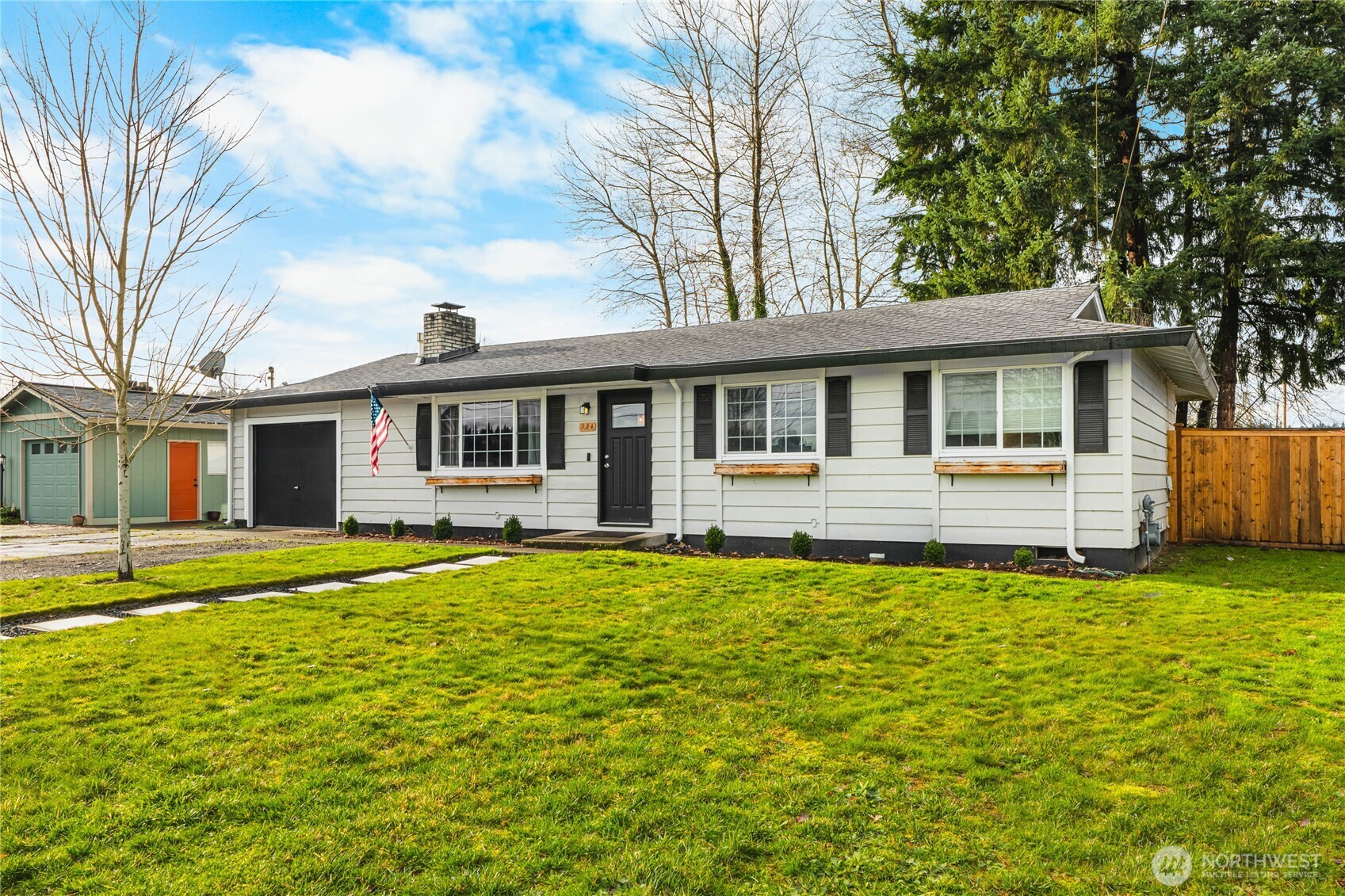 924 9th Street Southwest Puyallup, WA 98371 - Photo 3 of 38 a backyard of a house with table and chairs