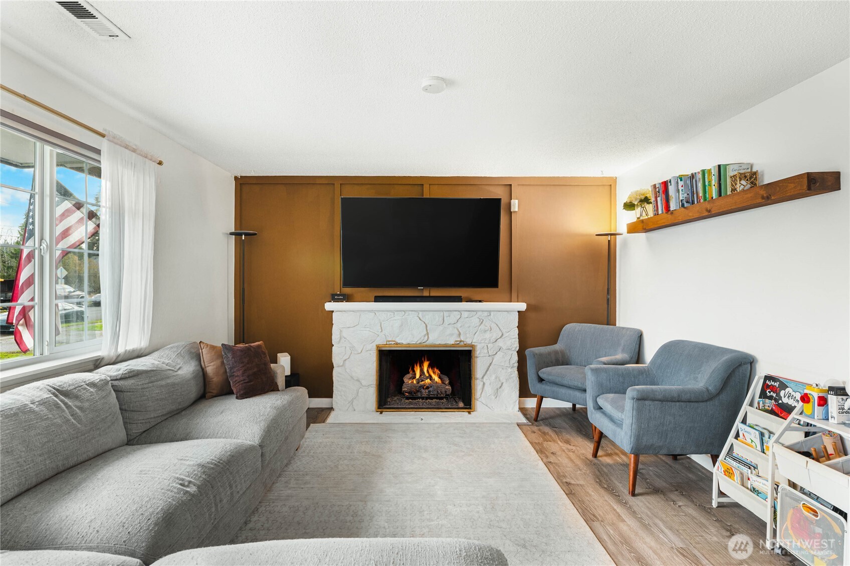 924 9th Street Southwest Puyallup, WA 98371 - Photo 8 of 38 a living room with furniture and a fireplace