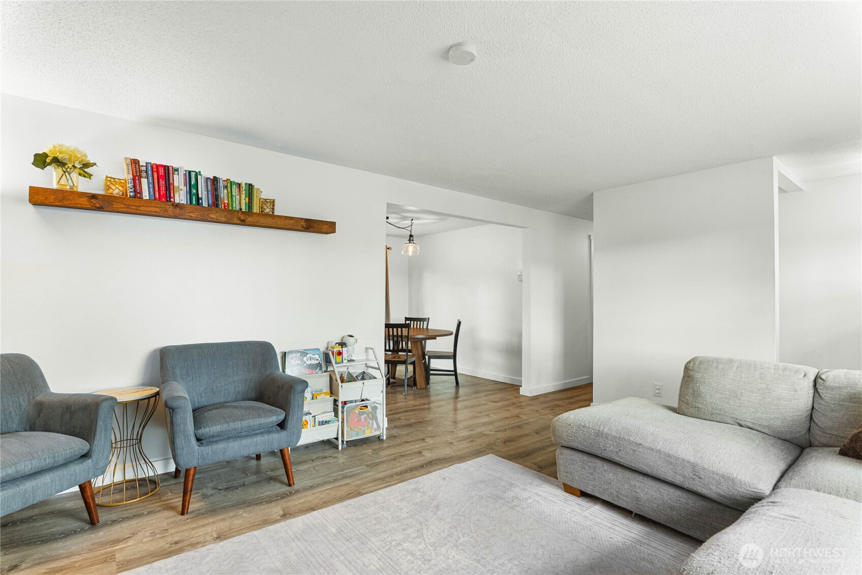 924 9th Street Southwest Puyallup, WA 98371 - Photo 10 of 38 a living room with furniture and a wooden floor