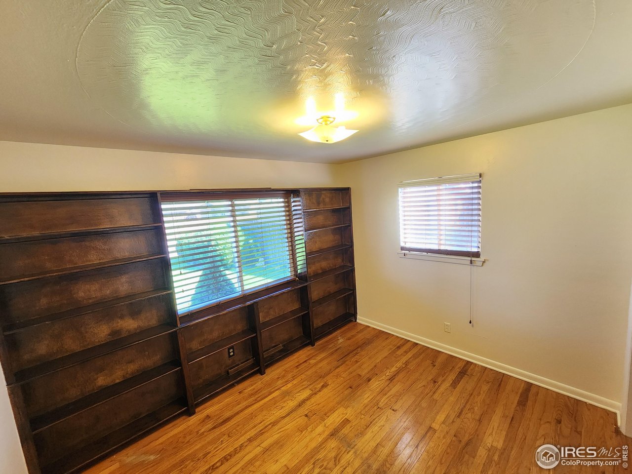 1107 Delmar Street Sterling, CO 80751 - Photo 11 of 49 a view of an empty room and window