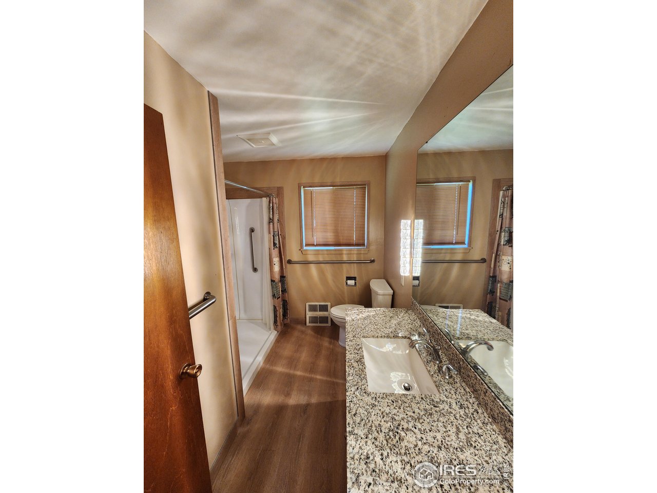 1107 Delmar Street Sterling, CO 80751 - Photo 14 of 49 a living room with furniture and a rug