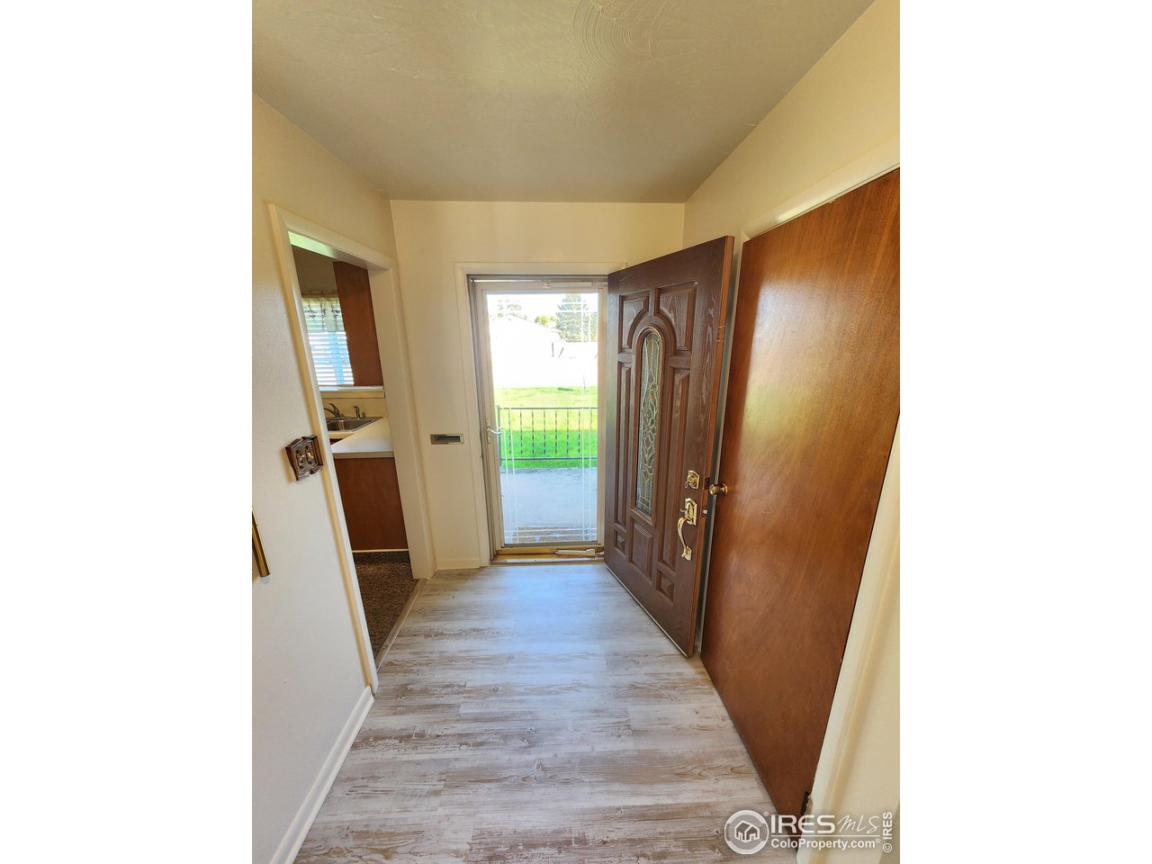 1107 Delmar Street Sterling, CO 80751 - Photo 2 of 49 a view of a kitchen from the hallway