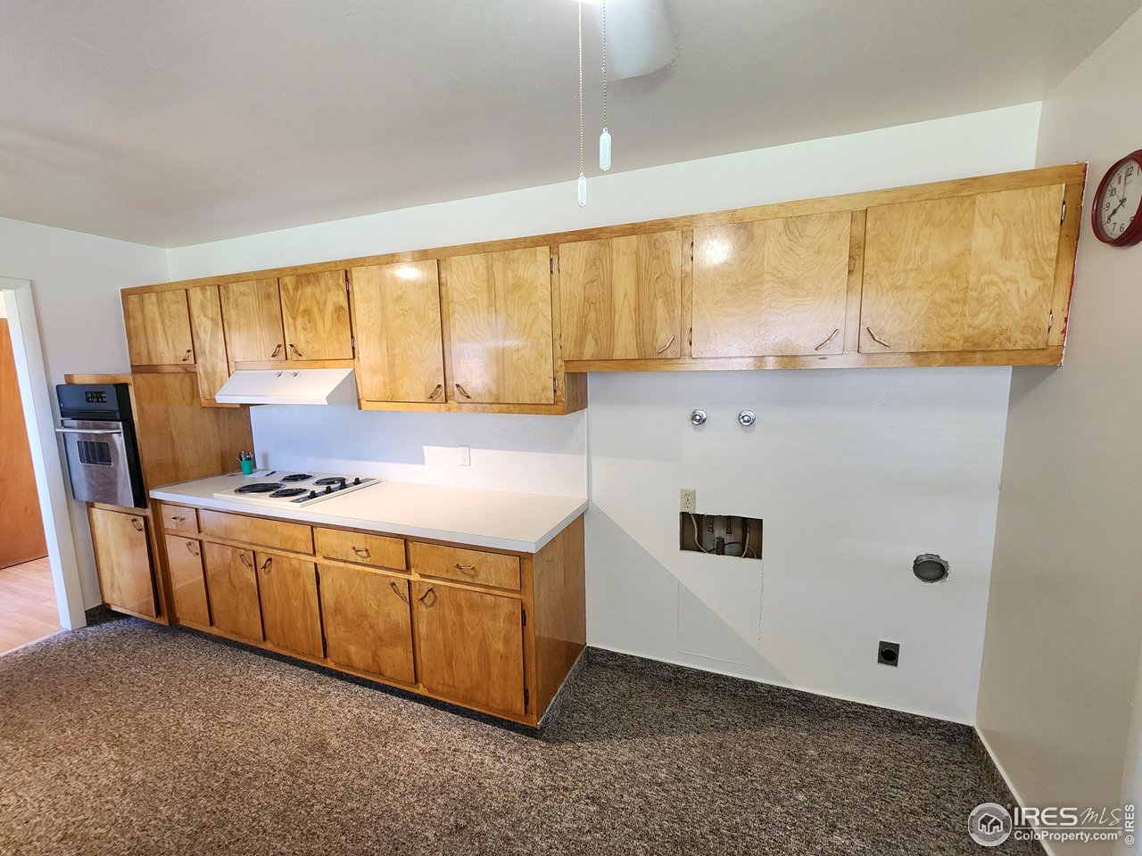 1107 Delmar Street Sterling, CO 80751 - Photo 22 of 49 a kitchen with stainless steel appliances granite countertop a sink a stove and a refrigerator