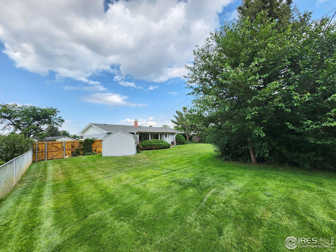 1107 Delmar Street Sterling, CO 80751 - Photo 31 of 49 a view of a backyard with garden