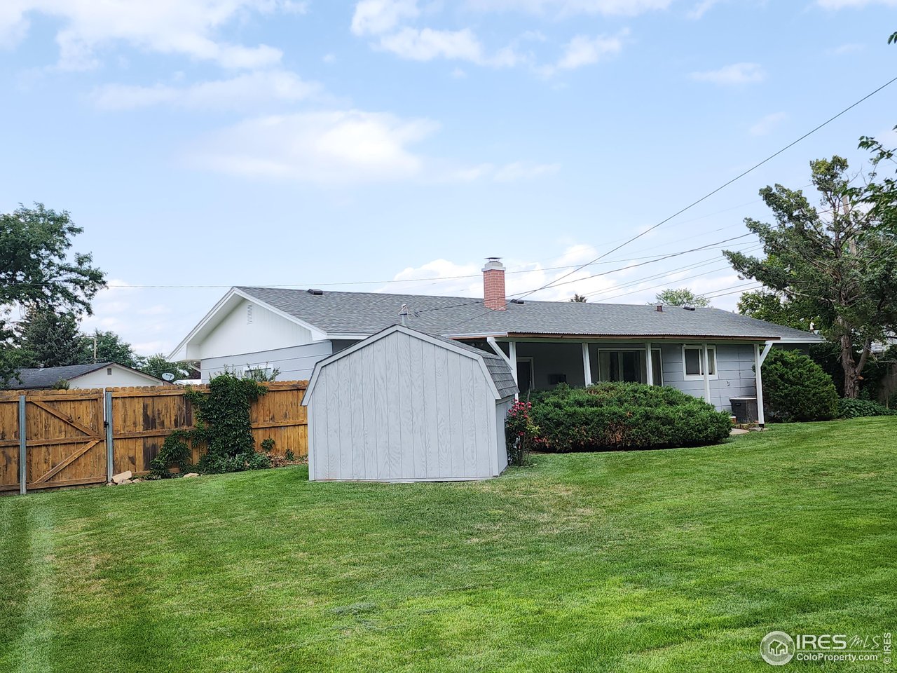 1107 Delmar Street Sterling, CO 80751 - Photo 32 of 49 a view of a backyard of the house