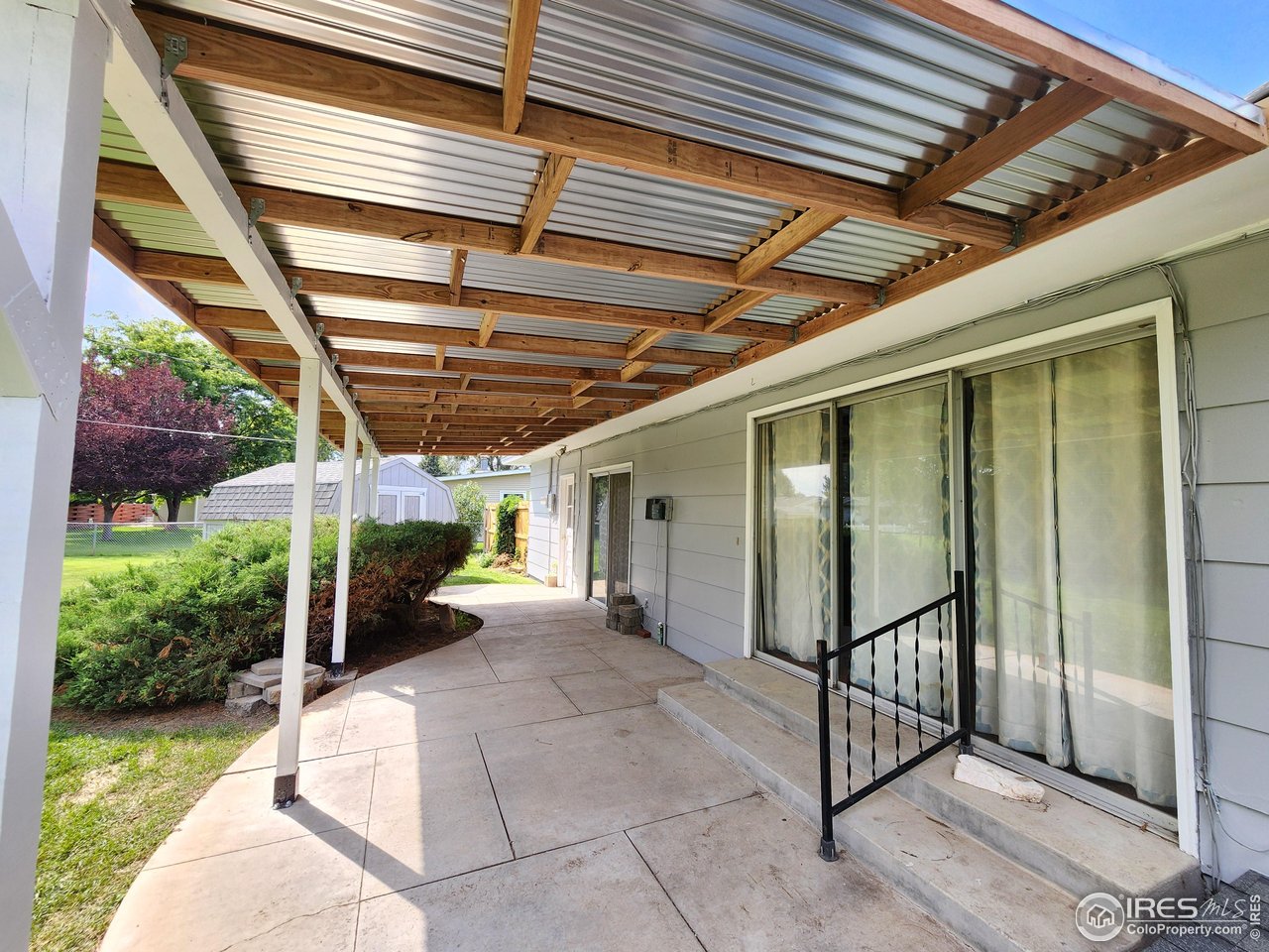1107 Delmar Street Sterling, CO 80751 - Photo 37 of 49 a view of a porch with furniture