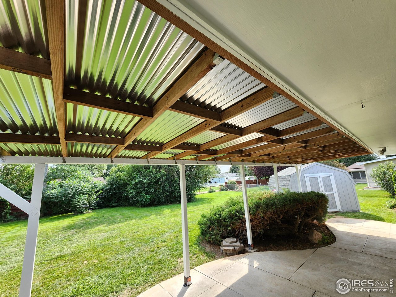 1107 Delmar Street Sterling, CO 80751 - Photo 38 of 49 a view of a backyard with table and chairs