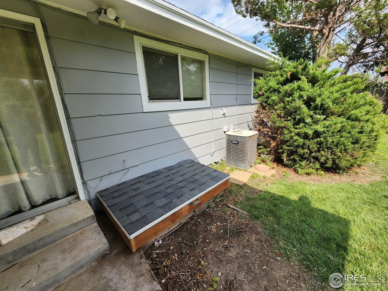 1107 Delmar Street Sterling, CO 80751 - Photo 39 of 49 a view of a backyard with chairs and dishwasher