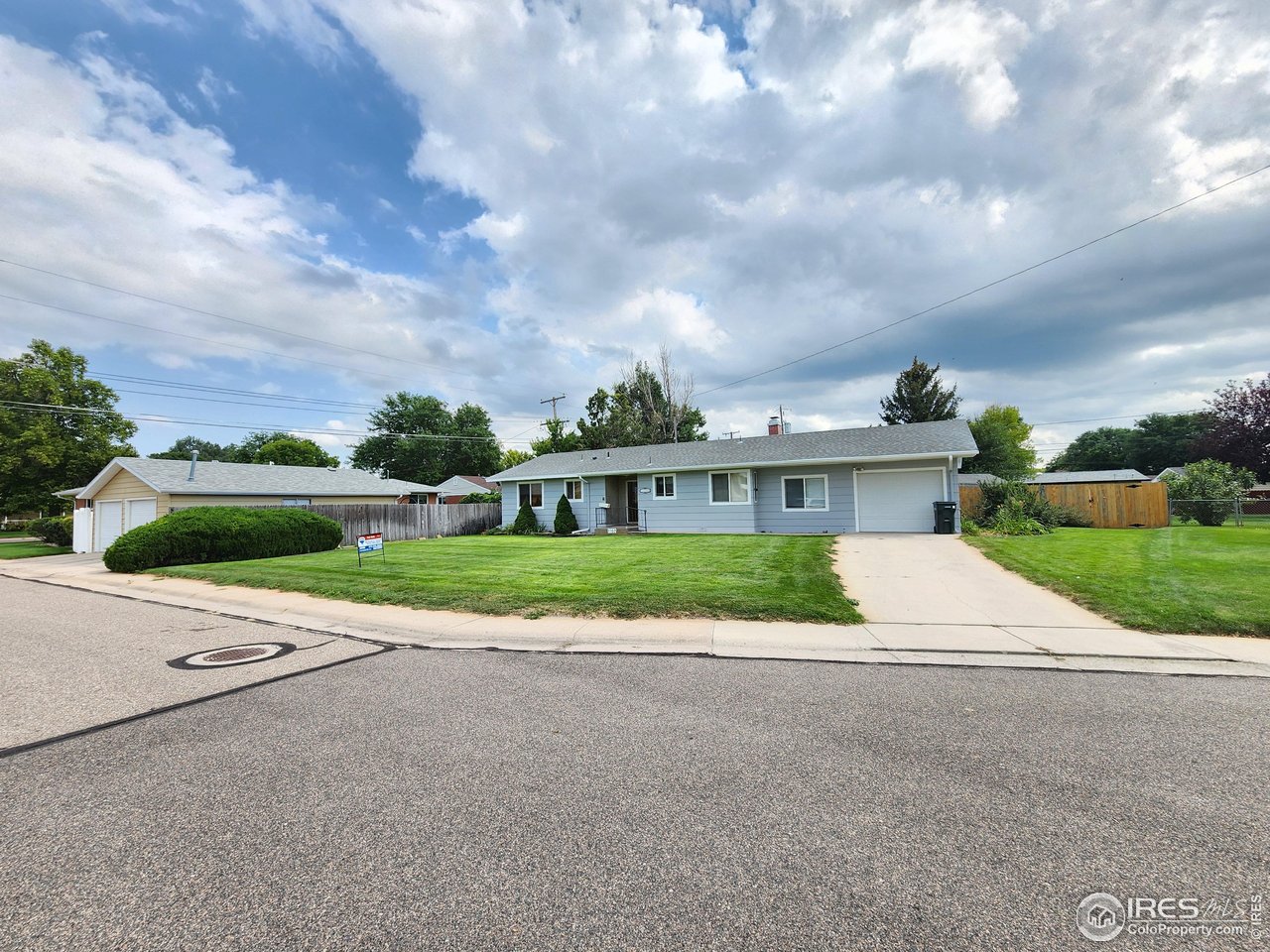 1107 Delmar Street Sterling, CO 80751 - Photo 47 of 49 a front view of house with yard and green space