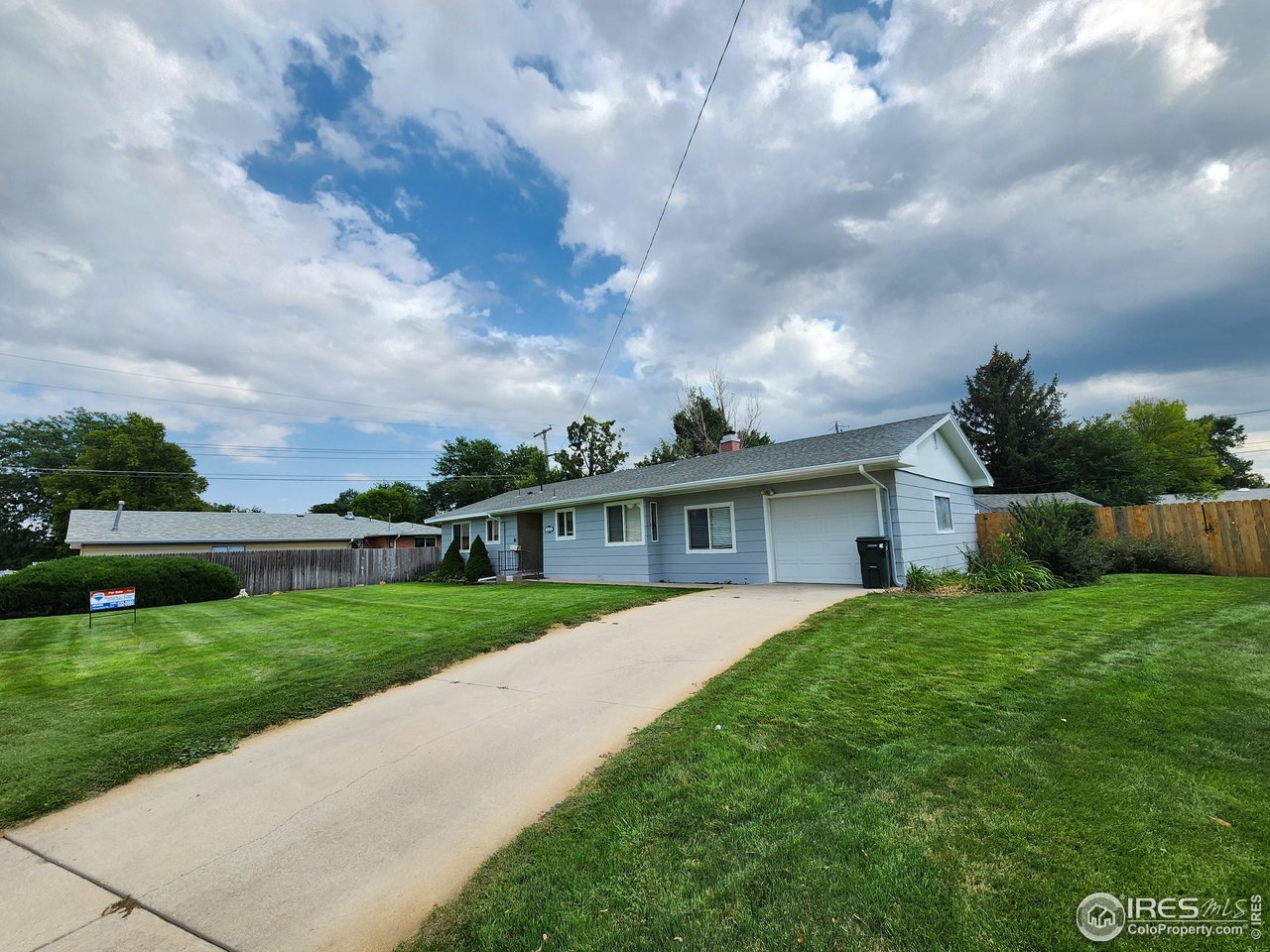 1107 Delmar Street Sterling, CO 80751 - Photo 48 of 49 a front view of a house with garden