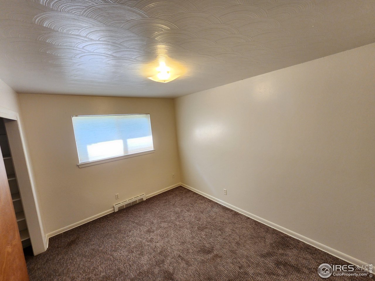 1107 Delmar Street Sterling, CO 80751 - Photo 9 of 49 a view of an empty room