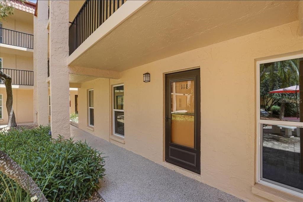 8911 Blind Pass Road, Unit 118 St. Pete Beach, FL 33706 - Photo 12 of 34 a view of a entryway of the house