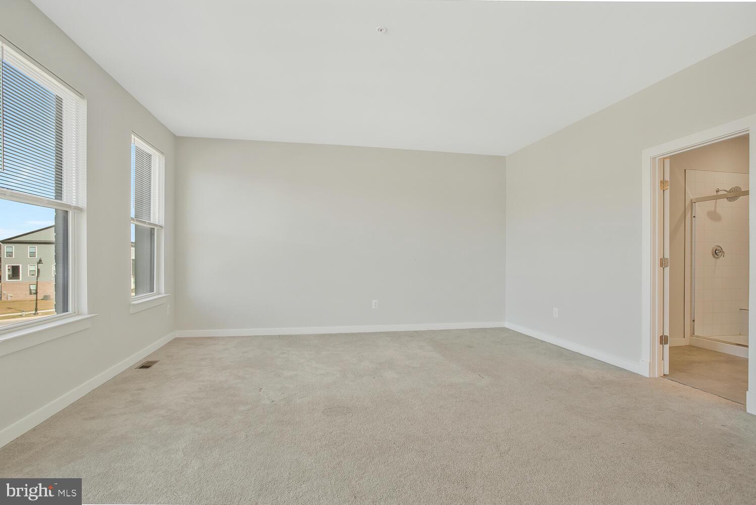 302 Summit Point Boulevard Bowie, MD 20716 - Photo 19 of 30 a view of an empty room with a window