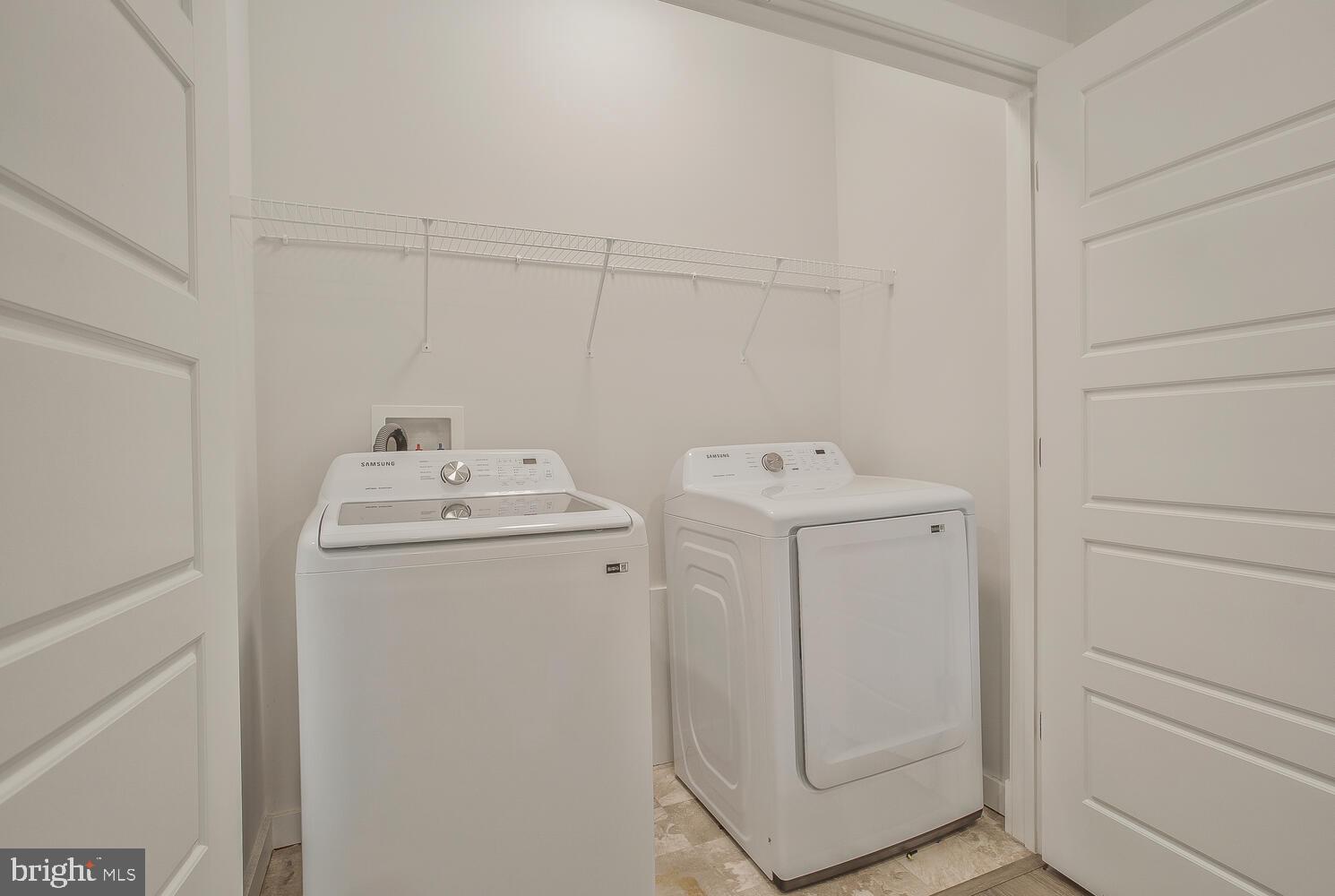 302 Summit Point Boulevard Bowie, MD 20716 - Photo 24 of 30 a utility room with dryer and washer