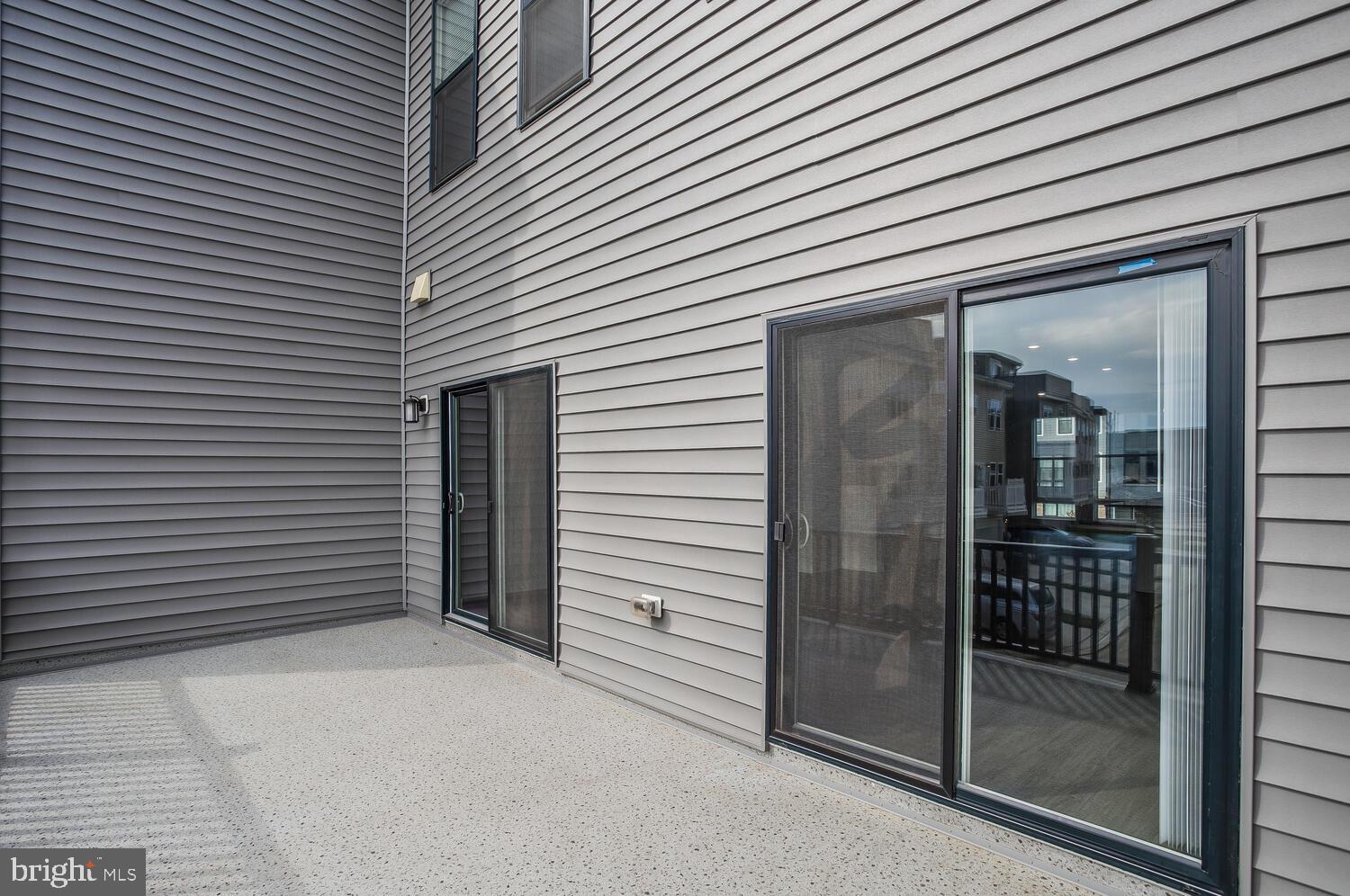 302 Summit Point Boulevard Bowie, MD 20716 - Photo 29 of 30 a view of a porch with a door and wooden floor