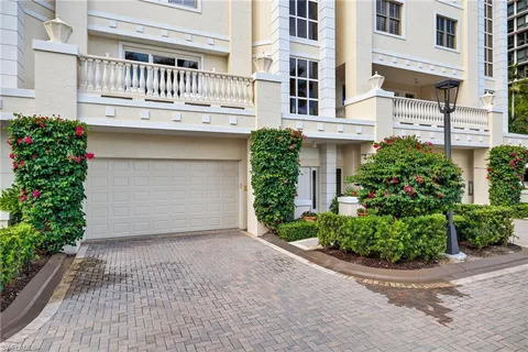 a front view of a house with a garage