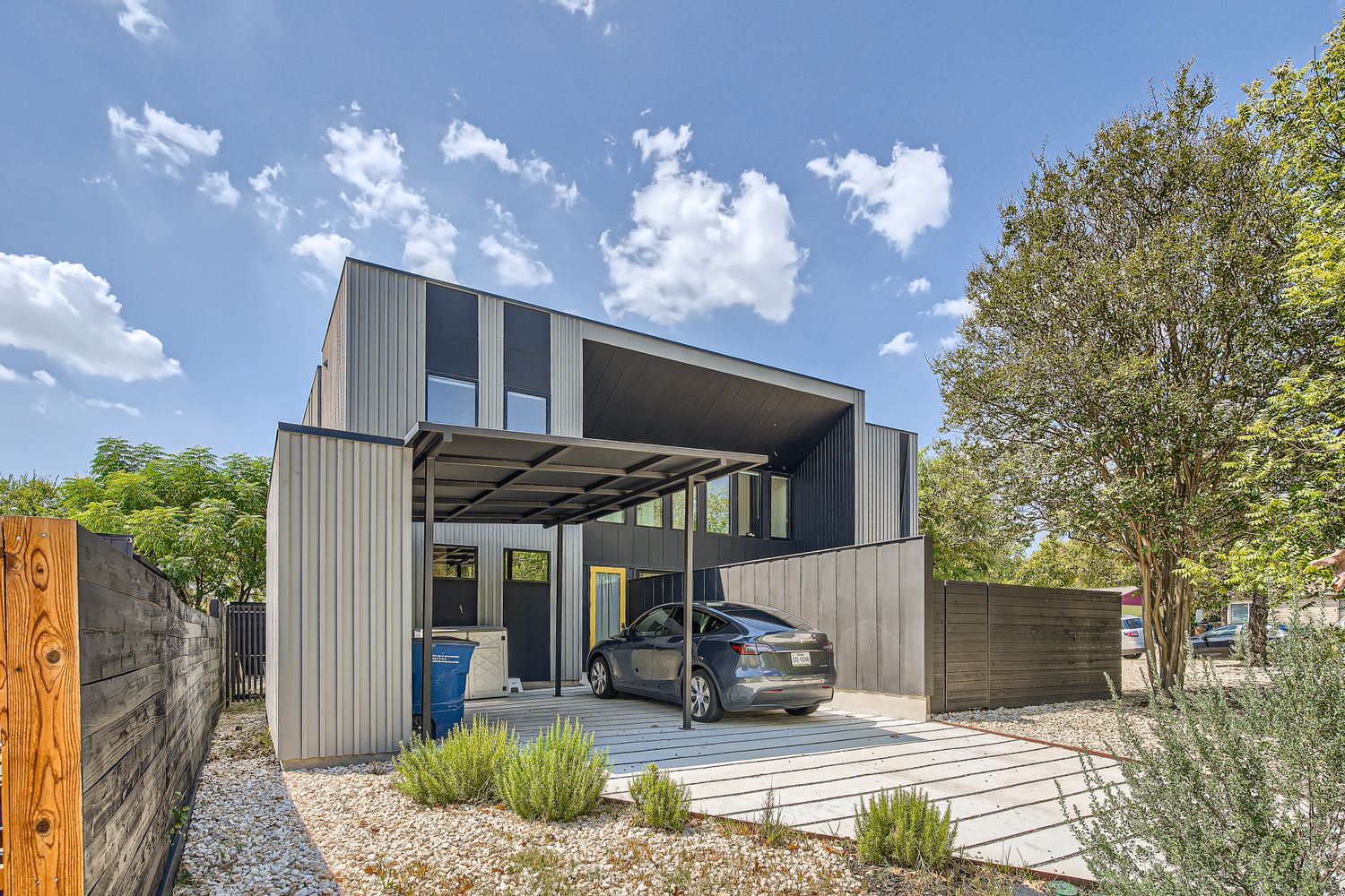 7525 Delafield Lane, Unit A Austin, TX 78752 - Photo 33 of 33 View of parking featuring a carport and driveway