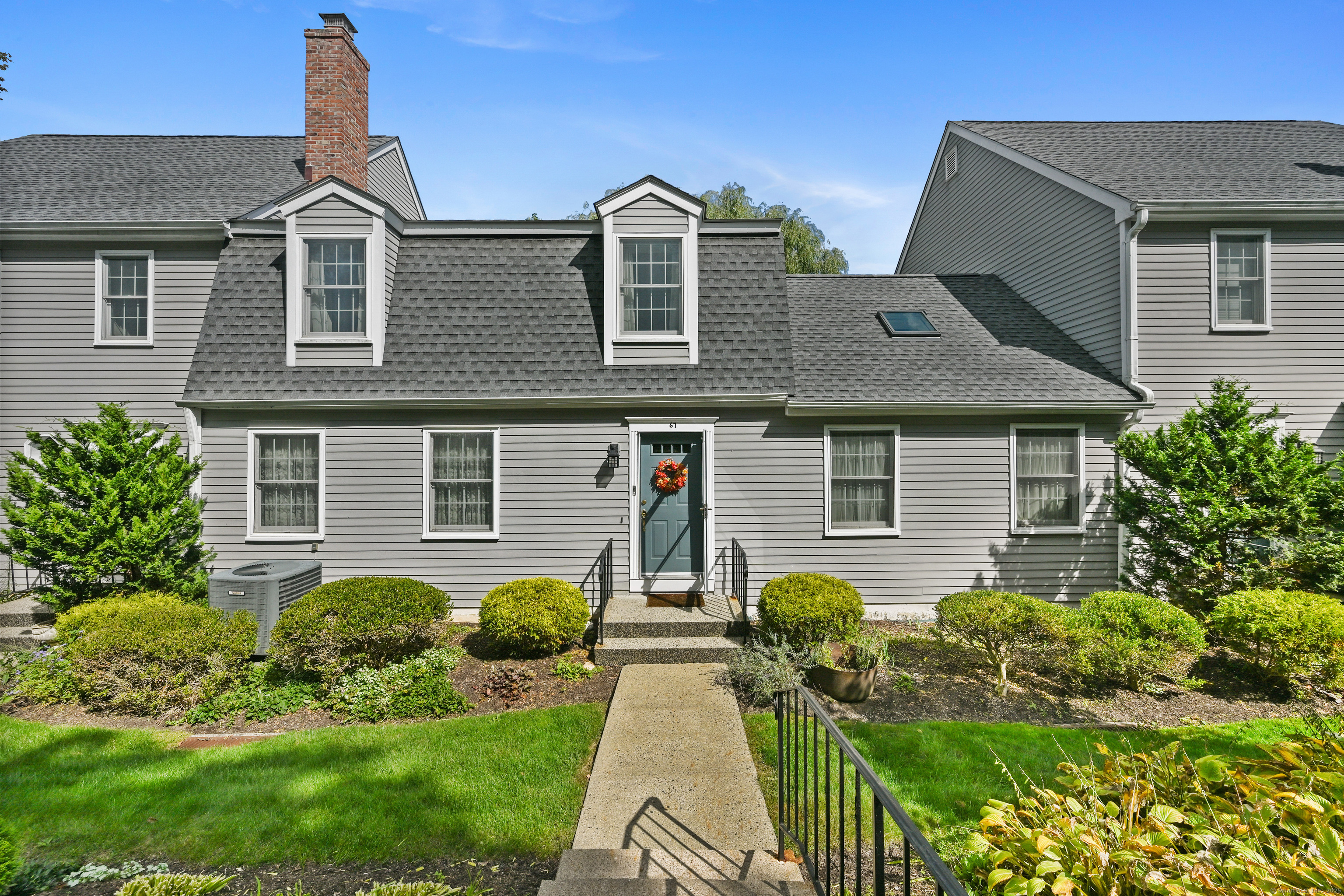 front view of a house with a yard