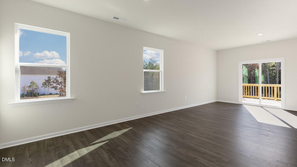 433 Hvn Hl Road Hillsborough, NC 27278 - Photo 11 of 33 a view of an empty room with wooden floor and a window