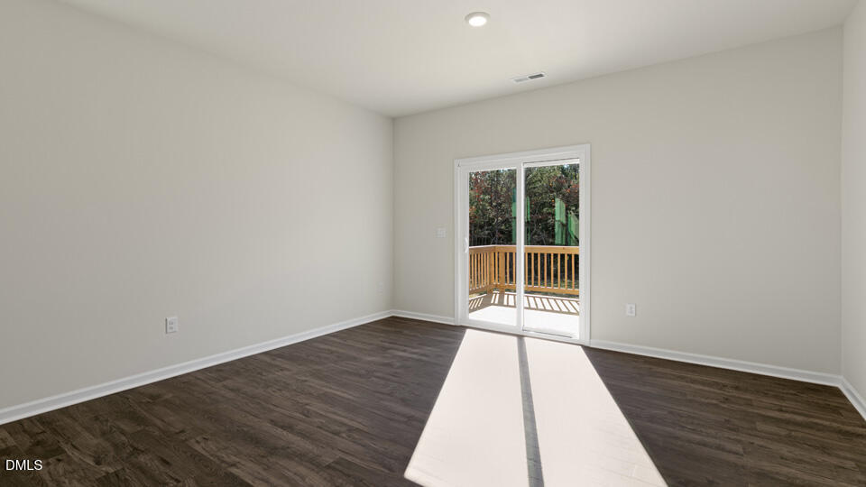433 Hvn Hl Road Hillsborough, NC 27278 - Photo 12 of 33 an empty room with wooden floor and windows