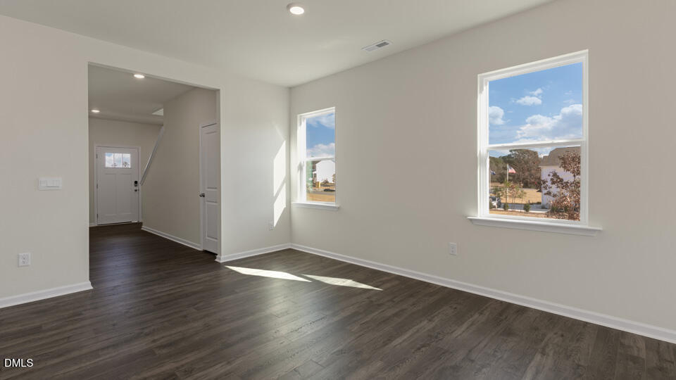 433 Hvn Hl Road Hillsborough, NC 27278 - Photo 3 of 33 an empty room with wooden floor and windows