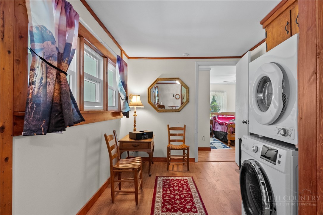 154 Folger Road Sparta, NC 28675 - Photo 11 of 37 a view of a hallway with washer and dryer