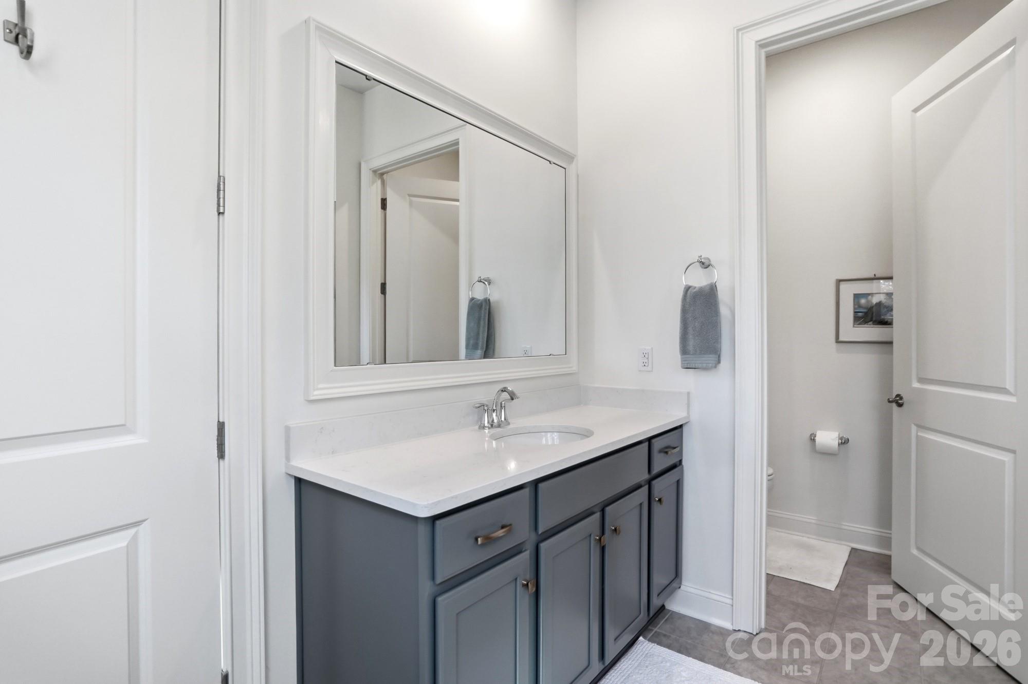 4012 Pollock View Mount Mount Holly, NC 28120 - Photo 18 of 48 a bathroom with a sink and a mirror