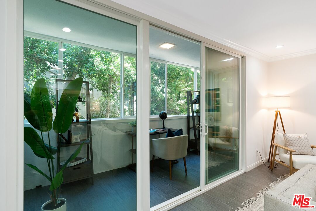 1015 North Kings Road, Unit 110 West Hollywood, CA 90069 - Photo 18 of 38 a room with window and stairs