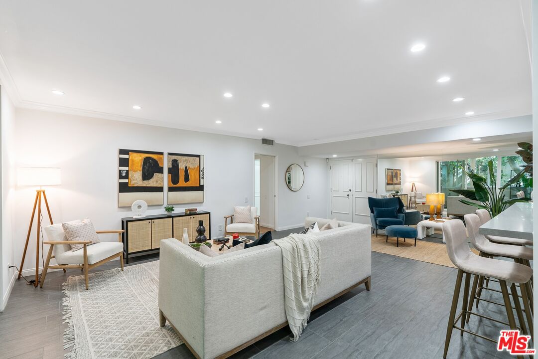 1015 North Kings Road, Unit 110 West Hollywood, CA 90069 - Photo 5 of 38 a living room with furniture and a wooden floor