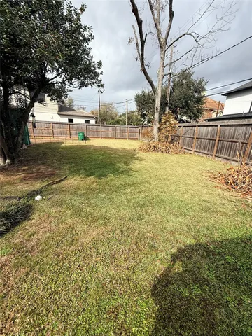 a view of a yard with table and chairs