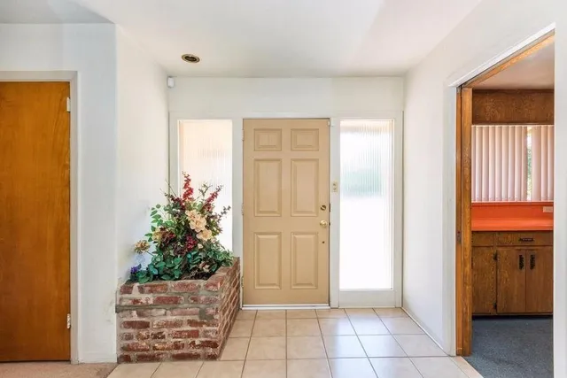 a view of an entryway with front door