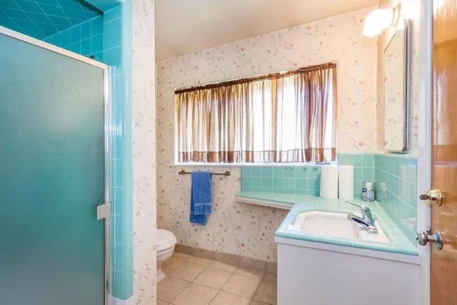 a bathroom with a sink a toilet and tub