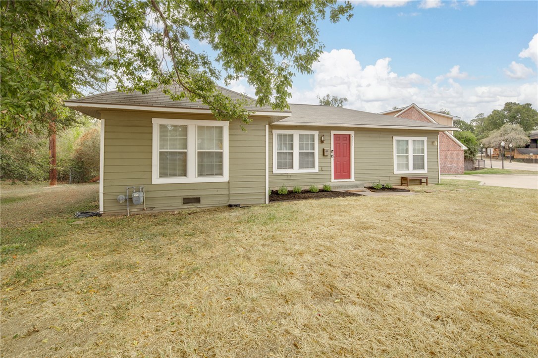 front view of a house with a yard