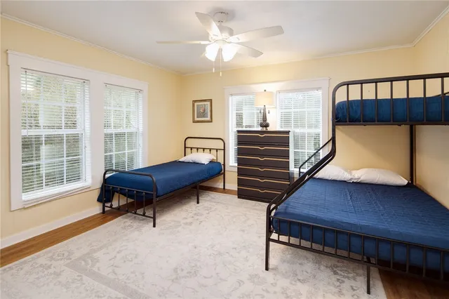 a bedroom with furniture and a window