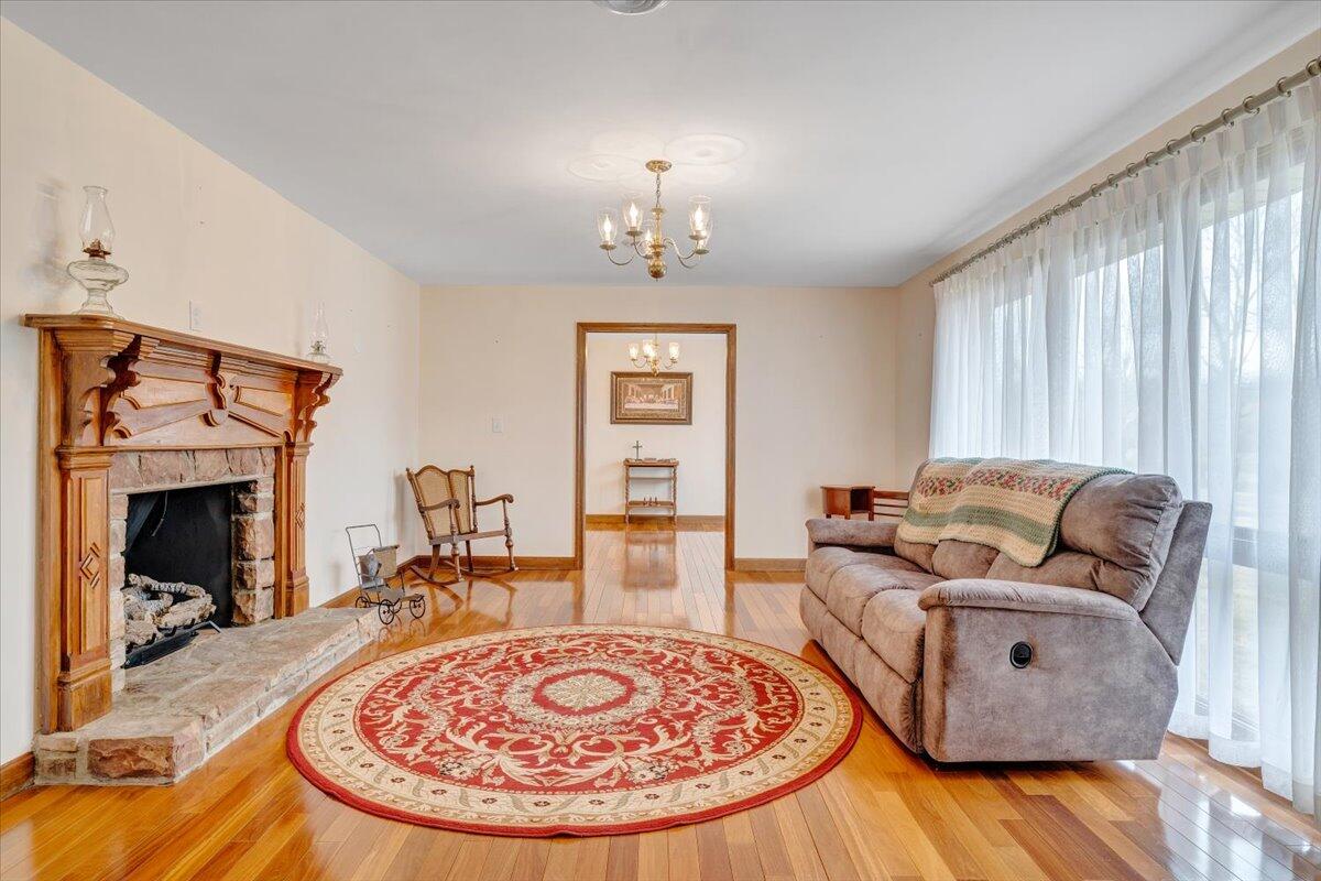 1167 St Peters Road Speedwell, VA 24374 - Photo 4 of 40 a living room with furniture and a fireplace