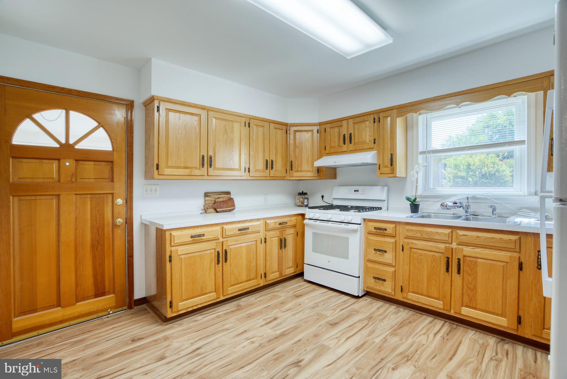7719 Fordson Road Alexandria, VA 22306 - Photo 11 of 40 Kitchen has door to carport and driveway