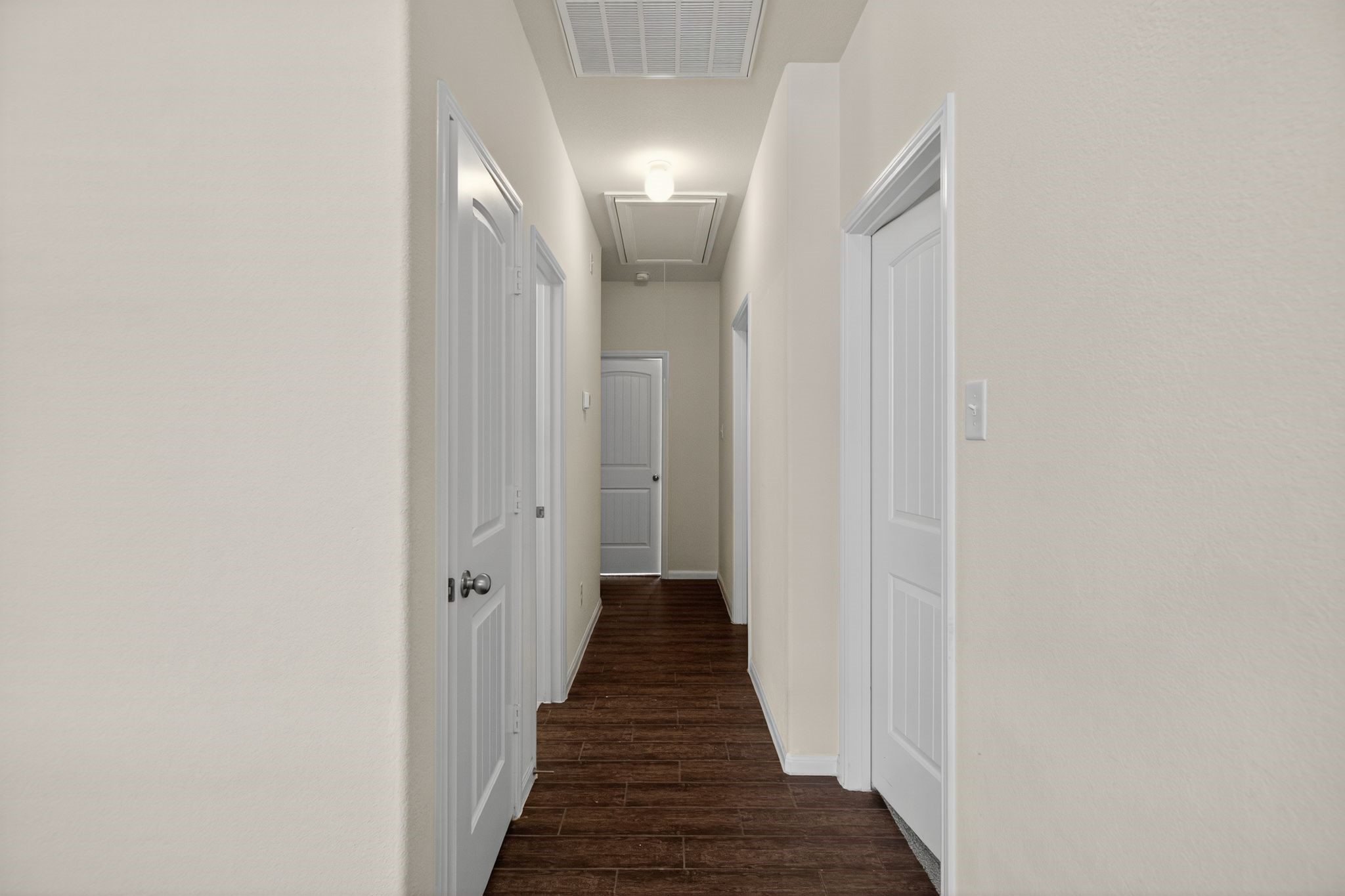 22514 Rustic Valley Court Porter, TX 77365 - Photo 14 of 33 a view of a hallway with wooden floor and stairs