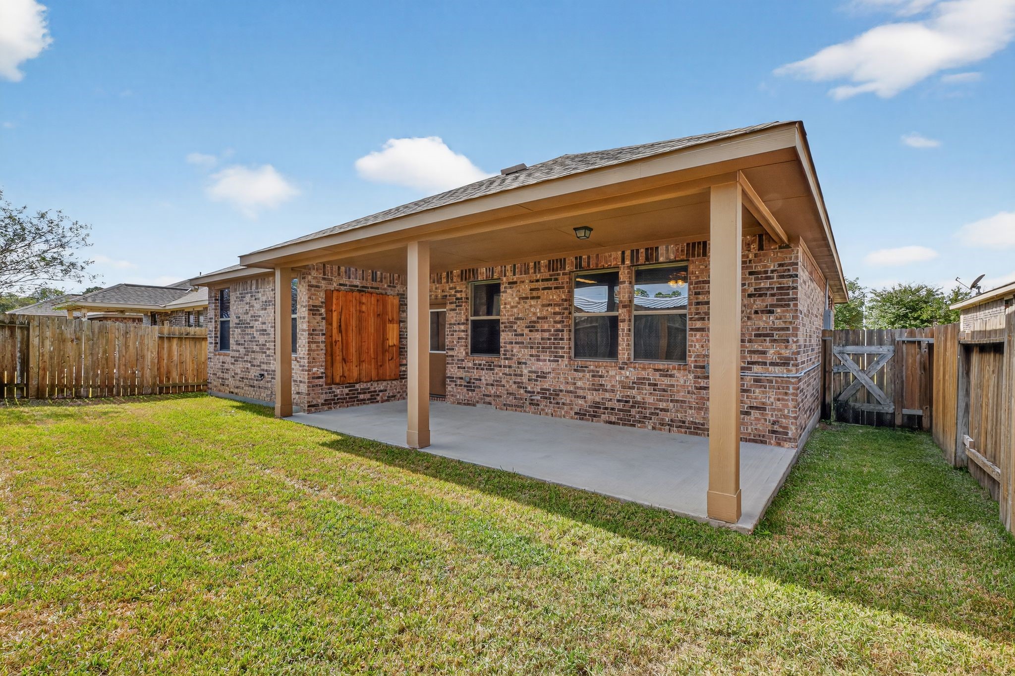 22514 Rustic Valley Court Porter, TX 77365 - Photo 31 of 33 a view of a house with backyard and porch