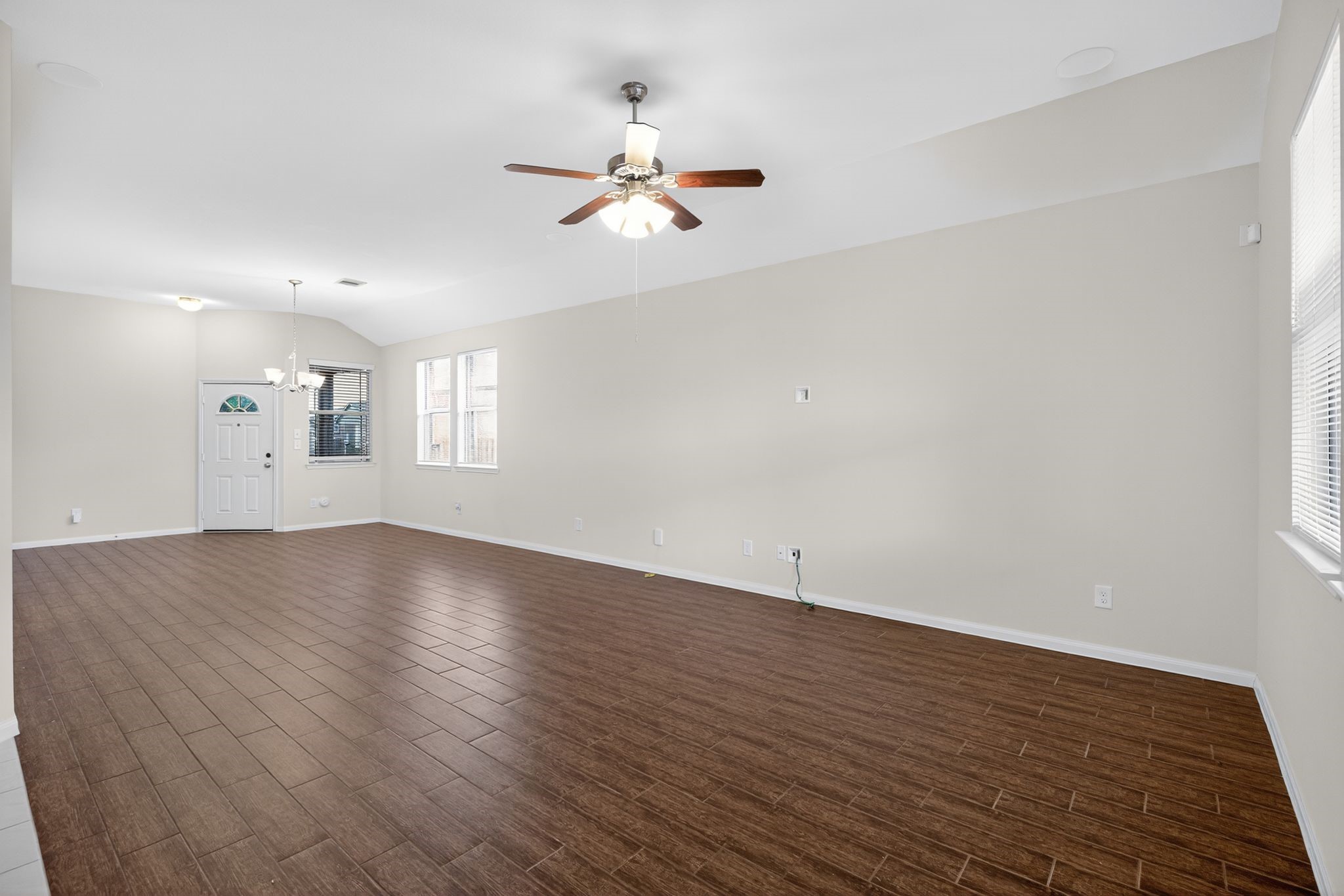 22514 Rustic Valley Court Porter, TX 77365 - Photo 6 of 33 wooden floor in an empty room with a window