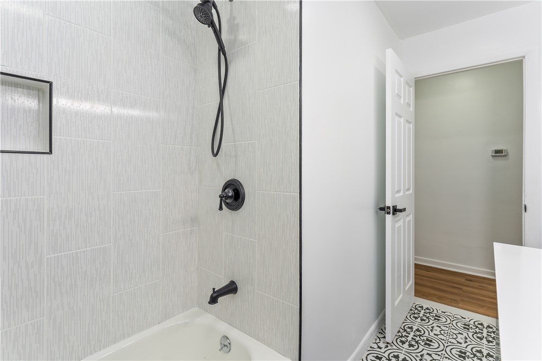 81 Spencerport Road Gates, NY 14606 - Photo 18 of 30 Brand new tub/shower, tile surround, & shower hard