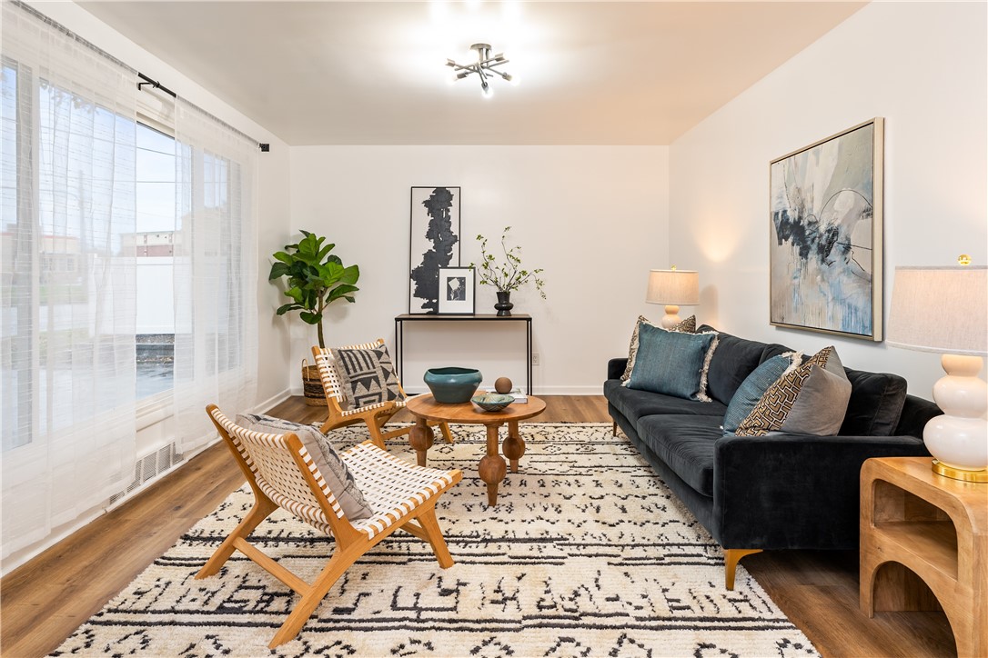 81 Spencerport Road Gates, NY 14606 - Photo 3 of 30 Spacious living room with updated modern light fix
