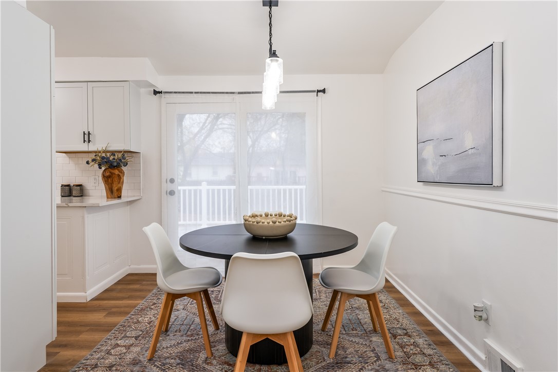 81 Spencerport Road Gates, NY 14606 - Photo 6 of 30 Dining area with updated modern light fixture