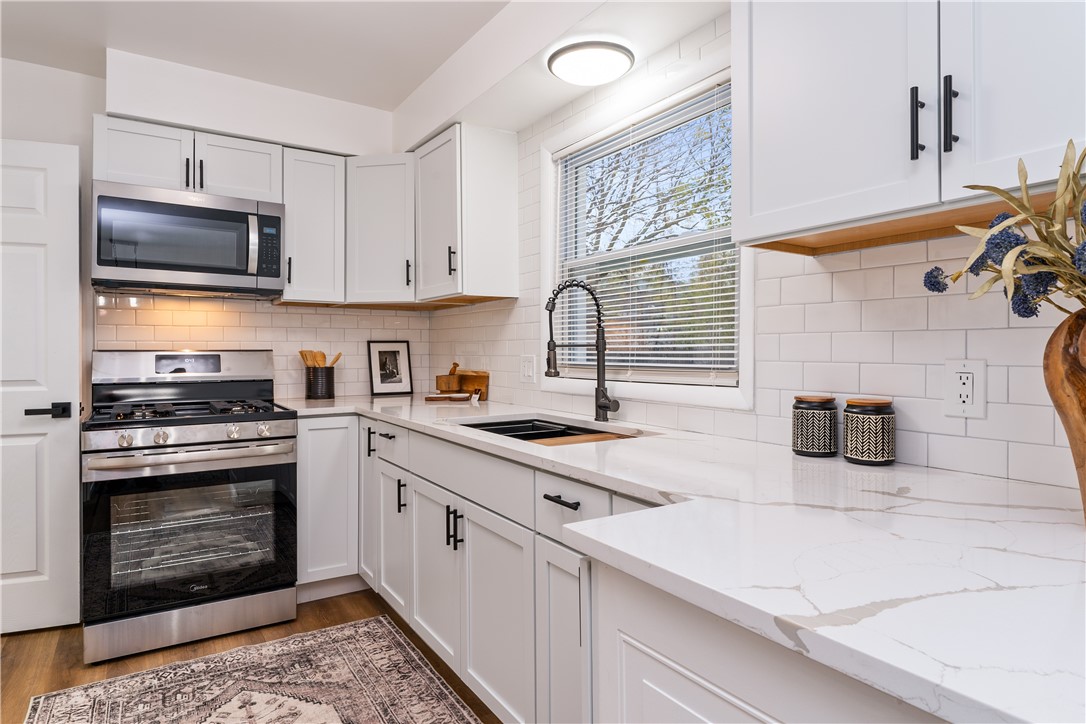 81 Spencerport Road Gates, NY 14606 - Photo 10 of 30 White shaker cabinets, quartz countertops, subway