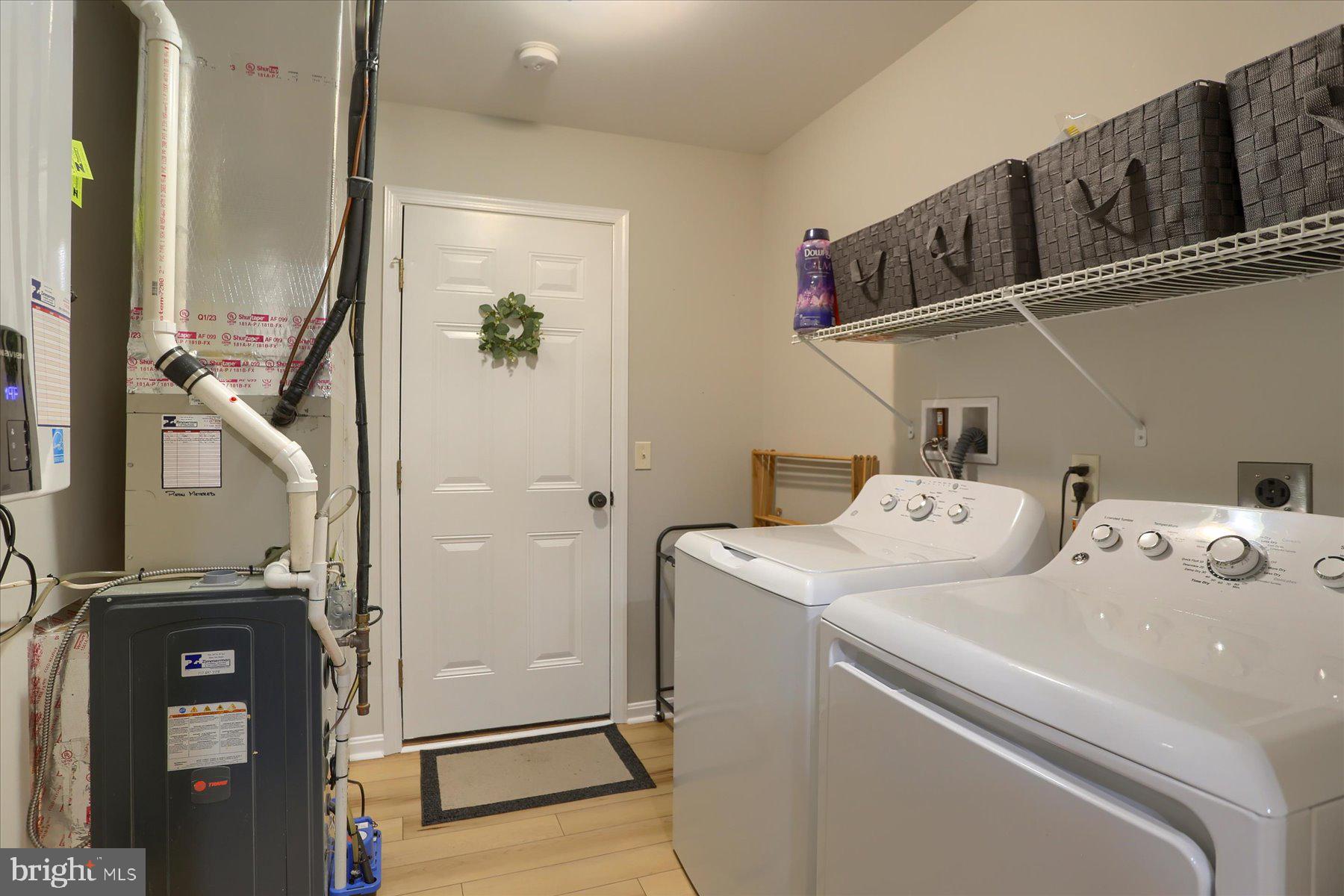 2398 Mill Road Mechanicsburg, PA 17055 - Photo 19 of 24 a utility room with closet dryer and washer