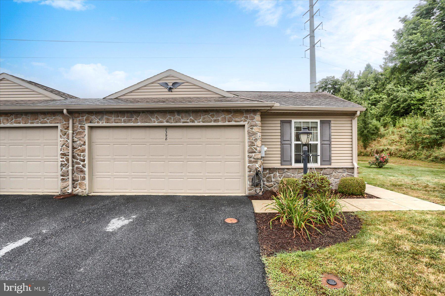 2398 Mill Road Mechanicsburg, PA 17055 - Photo 21 of 24 a front view of a house with a yard and garage