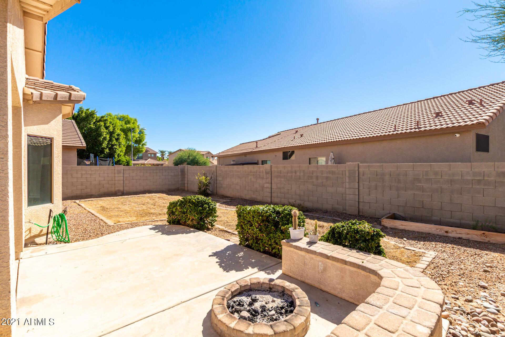14613 West Redfield Road Surprise, AZ 85379 - Photo 23 of 28 Rear yard w/fire pit