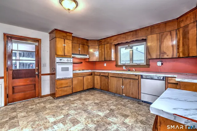 a view of a livingroom with wooden floor and cabinet