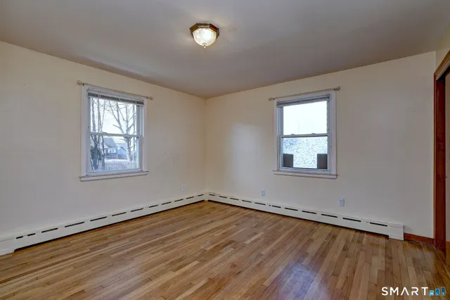 a view of a hallway view with three rooms