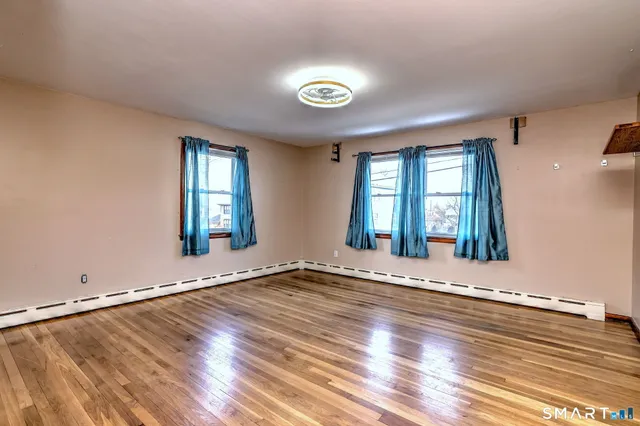 a view of a bedroom from a hallway